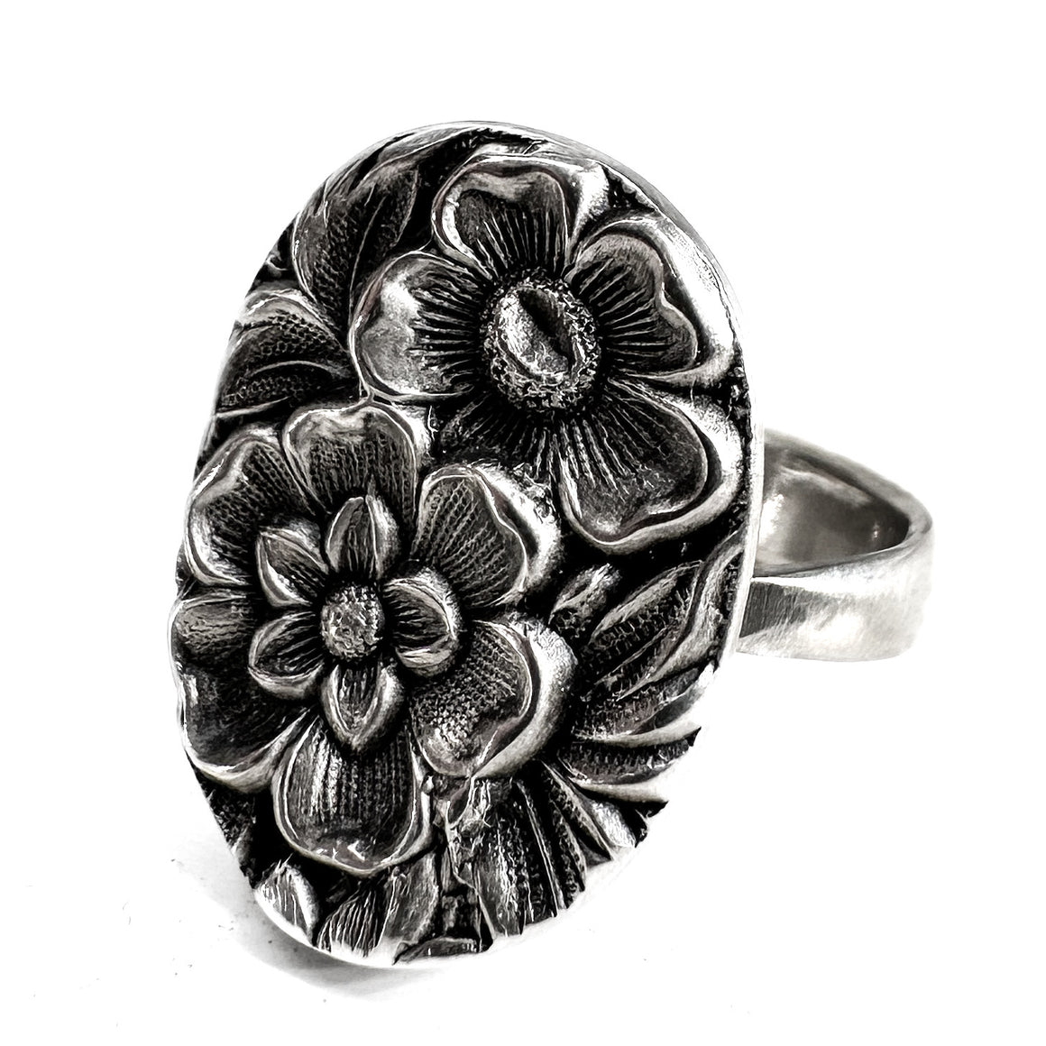 Sterling floral repousse ring